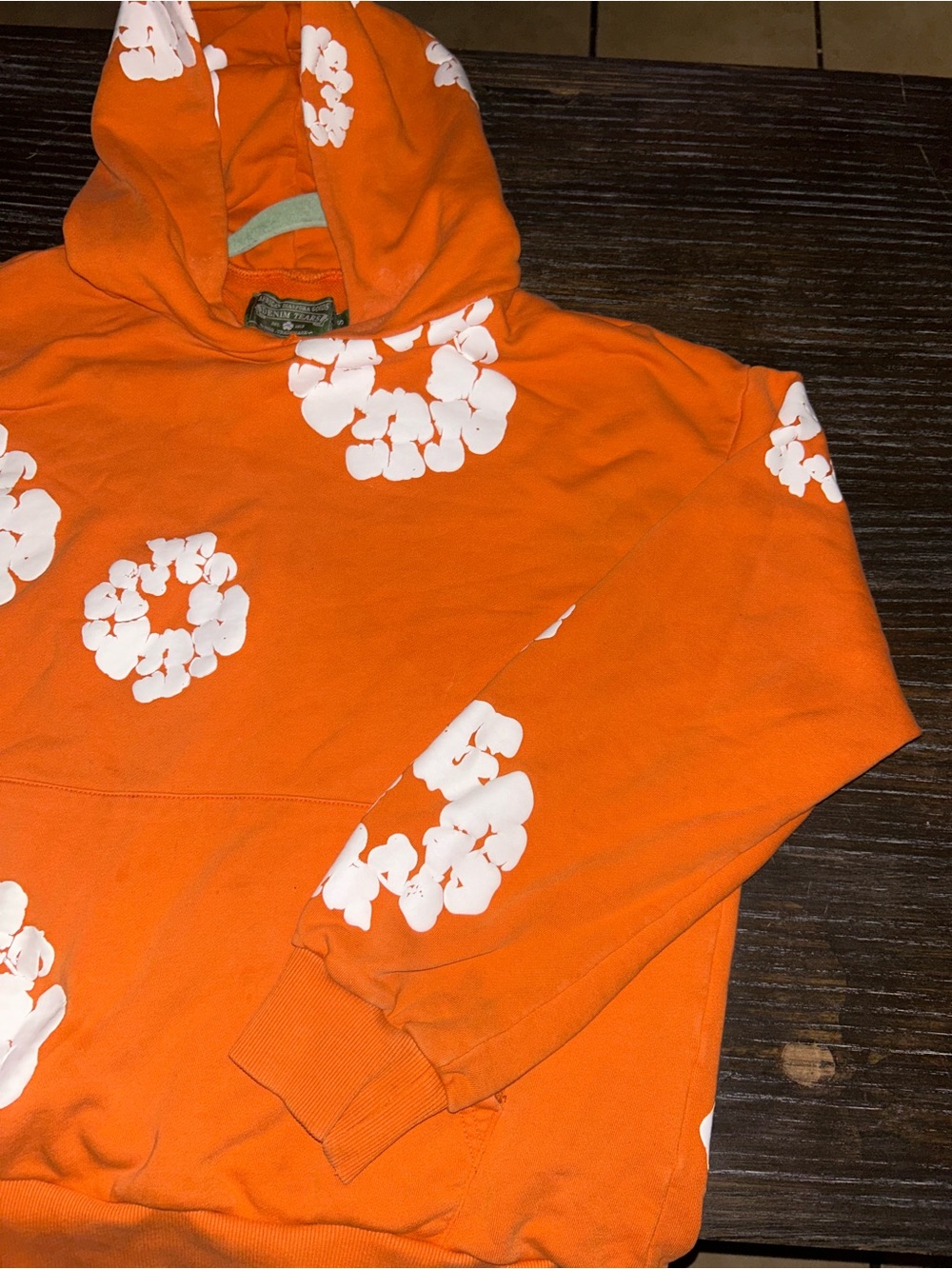 Orange Hoodie with White Floral Rings